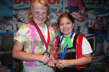 Natasha Williamson and Christina Rogers with team trophy