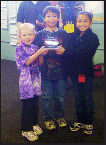 Emma Ogle, Jeshua Jacklet, and Maggie Comer with Ober Gatlinburg trophy