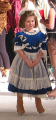 A child skater in her dress for the party